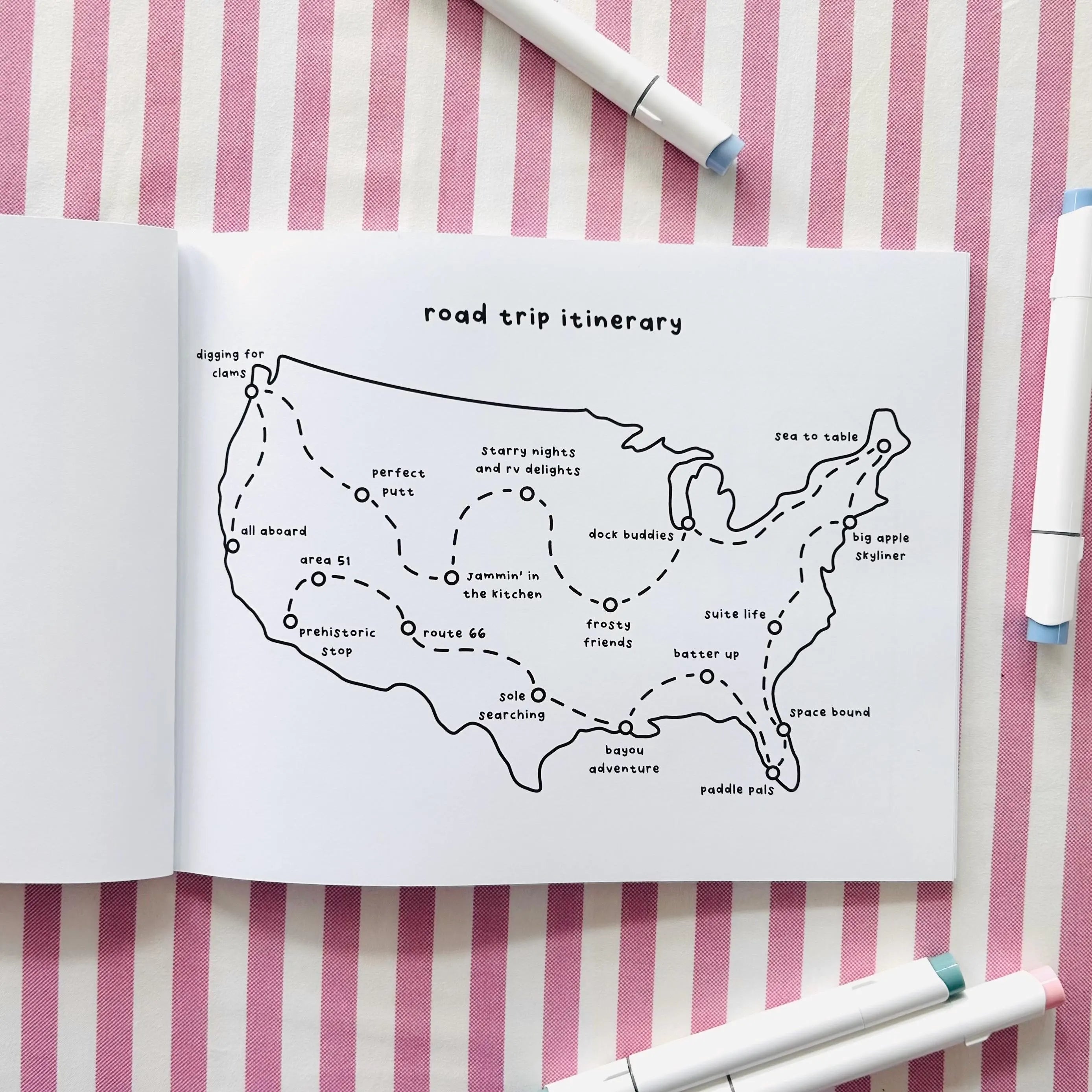 Open coloring book of a USA map and marked locations.